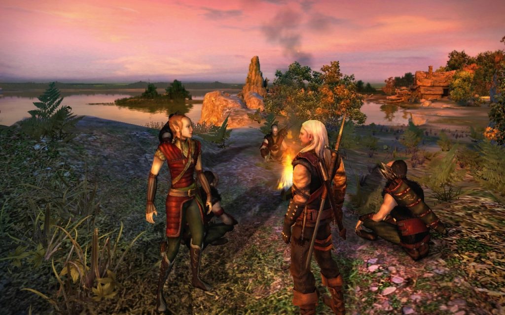 The Witcher Remake characters around a fire.