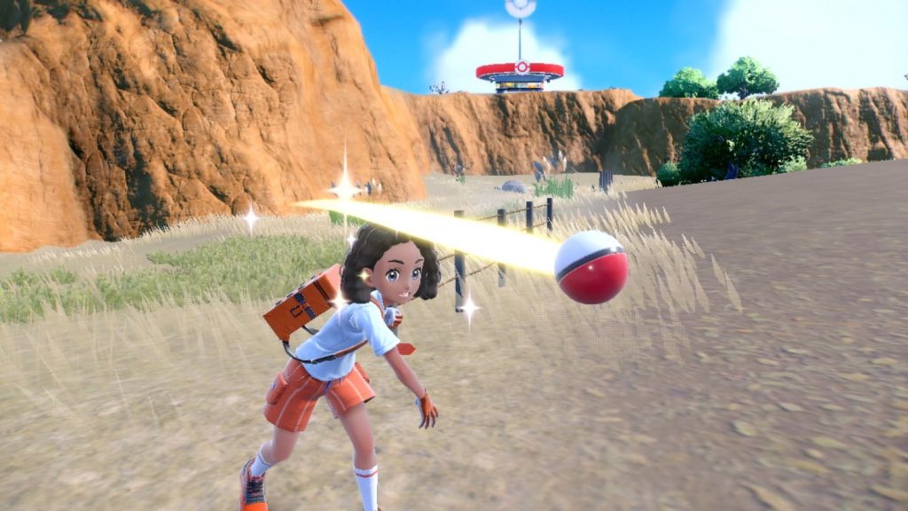 Gameplay footage of a character throwing a Pokeball to catch a pokemon.