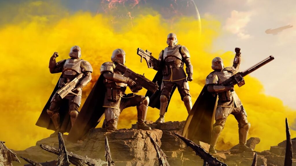 Helldivers2 four ttiumphant soldiers stand ona  hill.
